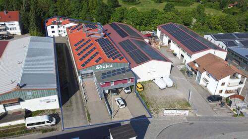 Luftbild - Sofort frei: Top gepflegte 2-stöckige Gewerbeimmobilie mit 3-Familienhaus in Ravensburg-Schmalegg