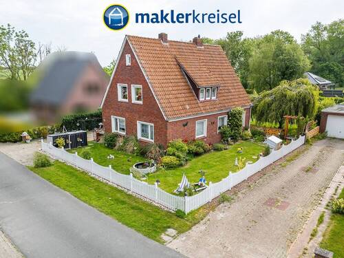 Bild 1 - Wangerland: Einfamilienhaus mit großem Grundstück in ruhiger Lage von Tettens nähe Nordseeküste!