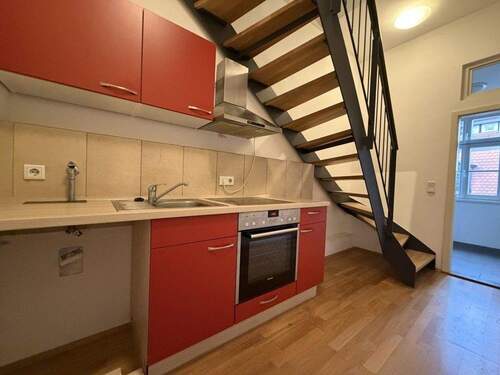 Flur mit integrierter Küche - 2 Zimmer Etagenwohnung in Erlangen