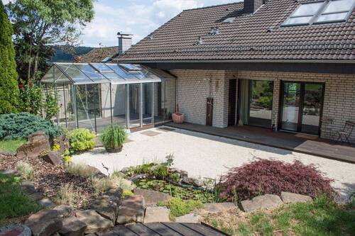 Terrasse mit Glashaus - 