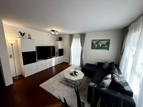 Whonzimmer 1 - Charmante Eigentumswohnung mit Terasse,Aufzug,Fußbodenheizung,Kellerabteil und 2xTG-Stellplätze