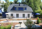 Ansicht Gartenseite - Ferienhaus top Einnahmen - Doppelhaus- direkt am Bodden vor der Insel Ummanz auch als Erstwohnsitz auf der Insel Rügen