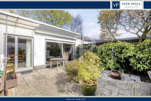 Atrium - Wohnen im Grünen: Charmanter Bungalow mit Süd-Atrium in Feldrandlage