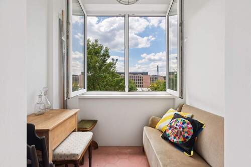 Wintergarten in Südwestausrichtung und mit Blick in den grünen Gemeinschaftsgarten - 3 Zimmer Etagenwohnung in Berlin