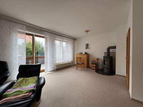 Wohnzimmer mit Kamin EG - 