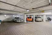 Ein ebenerdiger Tiefgaragenstellplatz kostet zzgl. 25.000 € - 
