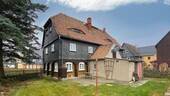Rück- und Seitenansicht - 6 Zimmer Einfamilienhaus zum Kaufen in Niedercunnersdorf