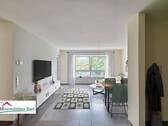 Wohnzimmer - LOSHEIM AM SEE: NEUWERTIGE 97 M² EG WOHNUNG MIT SICHT INS GRÜNE! SOFORT FREI!