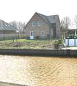 Ansicht Wasserseite - Exclusiv wohnen-Direkt am Wasser-mit Bootsanleger-freistehendes Einfamilien-Seehaus mit Garten, Terrasse, Carport mit Geräteraum,moderner Ausstattung