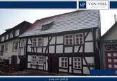 Haus Logo - Charmantes Einfamilienhaus in Top-Lage mit vielseitig nutzbarem Laden