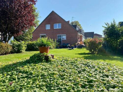 Garten - Vielseitiges Wohn- und Geschäftshaus mit Garage, Parkplätzen und großem Eigenlandgrundstück