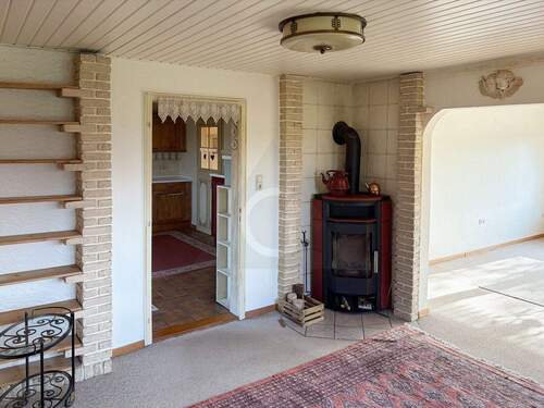 Wohnzimmer mit Kaminofen - 