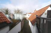 V1568_01 Blick ins rückwärtige Grundstück - 8 Zimmer Mehrfamilienhaus, Wohnhaus zum Kaufen in Vechta