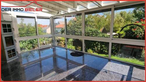 Wintergarten mit Kaminofen - 