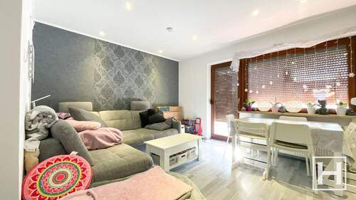 Wohnzimmer mit Terrassenzugang - 4 Zimmer Reihenmittelhaus zur Miete in Trappenkamp