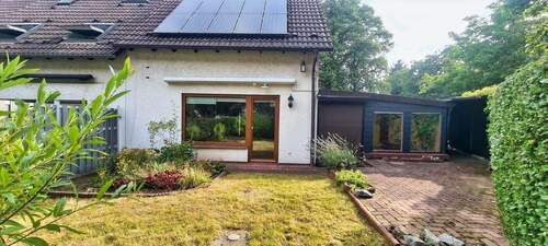 Gartenansicht mit Winterlaube - Familienfreundliches Reiheneckhaus mit Garten & Ausbaureserve