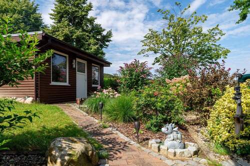 Der Zugang zur Garage - Mehrfamilienhaus, Wohnhaus mit 125,00 m&sup2; in Buschvitz zum Kaufen