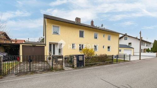 Außenansicht 2 - Lichtdurchflutete DHH mit Südgarten, Balkon & Garage - gepflegtes Zuhause mit viel Potenzial
