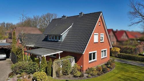 Vorderansicht - Rentables MFH mit 3 Parteien in toller Lage von Westerstede