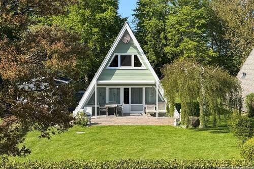 Hausansicht Garten - Urlaubsparadies an der Ostsee - 335.000,00&nbsp;EUR Kaufpreis, ca.&nbsp; 65,00&nbsp;m&sup2;&nbsp;Wohnfl&auml;che