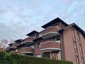 Rückansicht - Attraktive 3-Zimmer-Wohnung mit Balkon und geplanter Modernisierung