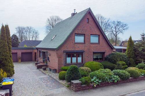Ansicht Haus - Charmantes Einfamilienhaus mit Einliegerwohnung auf großzügigem und sonnigem Grundstück in Fockbek