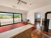 DG Wohnzimmer mit Kamin und Dachterrasse - 