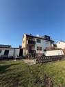 Hausrückseite mit Terrasse - Mehrfamilienhaus, Wohnhaus mit 95,00 m&sup2; in Großbettlingen zum Kaufen