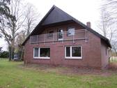 Bild 1 - Einfamilienhaus mit Garage und großem Grundstück