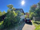 Giebelansicht mit Hofeinfahrt - 5 Zimmer Einfamilienhaus zum Kaufen in Mudau