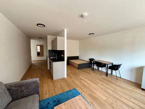 Wohnbereich - Großzügige, möblierte 1-Zimmer-Wohnung zum Erstbezug!