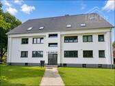 Ansicht - Wohnen im Niedrigenergiehaus KFW55 - 3-Zimmer-Wohnung mit Balkon - Ruhiglage am Waldrand.