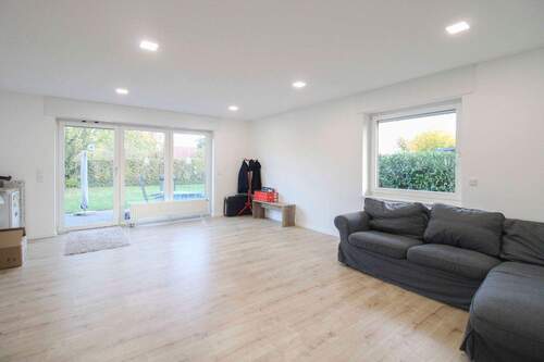 Wohnzimmer - Mehrfamilienhaus, Wohnhaus mit 160,60 m&sup2; in Neuenkirchen zum Kaufen