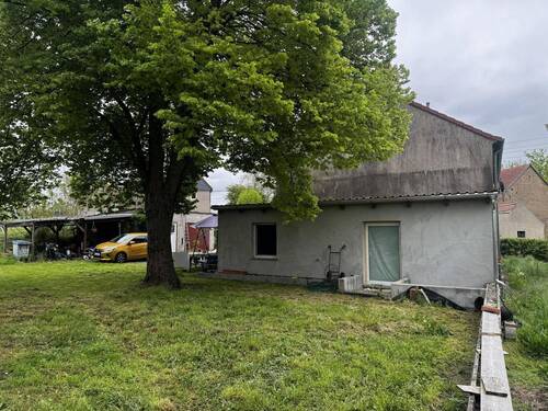 Rückansicht mit Anbau - 1 Zimmer Einfamilienhaus in Naundorf