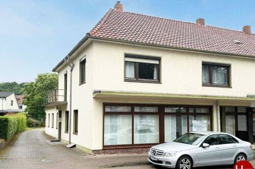 Haus kaufen in Achim – Hechler & Twachtmann Immobilien - Wohn- und Geschäftshaus mit rückwärtigem Bauplatz in bester Lage!