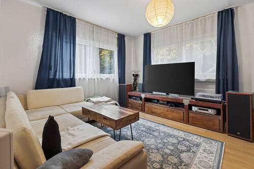 Wohnzimmer Erdgeschoss - Mehrfamilienhaus, Wohnhaus mit 302,00 m² in Ettlingen zum Kaufen