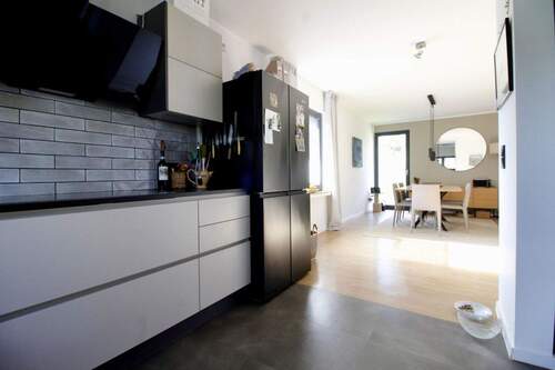 Küche mit Blick ins Esszimmer - Bungalow mit 160,00 m&sup2; in Wegberg zum Kaufen