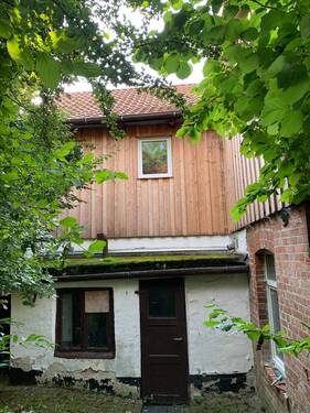 Rückansicht mit Nebeneingang - Einfamilienhaus mit 131,00 m² in Uehrde zum Kaufen