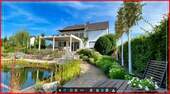 Hausansicht - Einfamilienhaus mit Traumgarten und Schwimmteich
