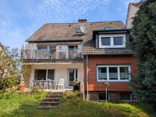 Bild 2 - 7 Zimmer Mehrfamilienhaus, Wohnhaus zum Kaufen in Hasbergen