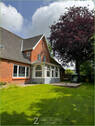 Giebelansicht mit Wintergarten und Veranda - 