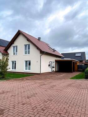 Bild 1 - Doppelhaushälfte mit Terrasse, Carport und Gerätehaus in Molbergen