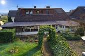 Sonniger Garten bei einem Hinterhaus - 7 Zimmer Einfamilienhaus zum Kaufen in Hetzerath / Erlenbach