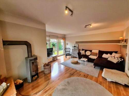 Gemütlicher Wohnbereich mit Ofen - Einfamilienhaus mit 141,00 m&sup2; in Schneverdingen zum Kaufen