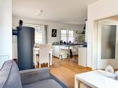 Wohnzimmer mit Kamin - 4 Zimmer Einfamilienhaus zum Kaufen in Wunstorf