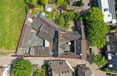 Ansicht aus der Vogelperspektive - Leben in einem denkmalgeschützten Vierkanthof mit diversen Anbauten in AC-Richterich, mit Erweiterungspotential*....