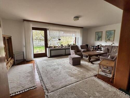 Wohnzimmer mit Zugang zur Westterrasse - 5 Zimmer Einfamilienhaus in Espelkamp