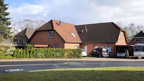 Seitenansicht - 1 Zimmer Mehrfamilienhaus, Wohnhaus in Uplengen