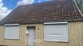 Fassade vorn - Einfamilienhaus mit großem Grundstück, Garagen und Entwicklungspotenzial in Uetersen - Katzhagen 12