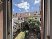 Begrünter Innenhof - Charmante 2-Zimmer-Altbauwohnung mit Blick ins Grüne im Herzen von Heidelberg-Bergheim